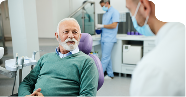 Smiling senior man sitting in a dental chair